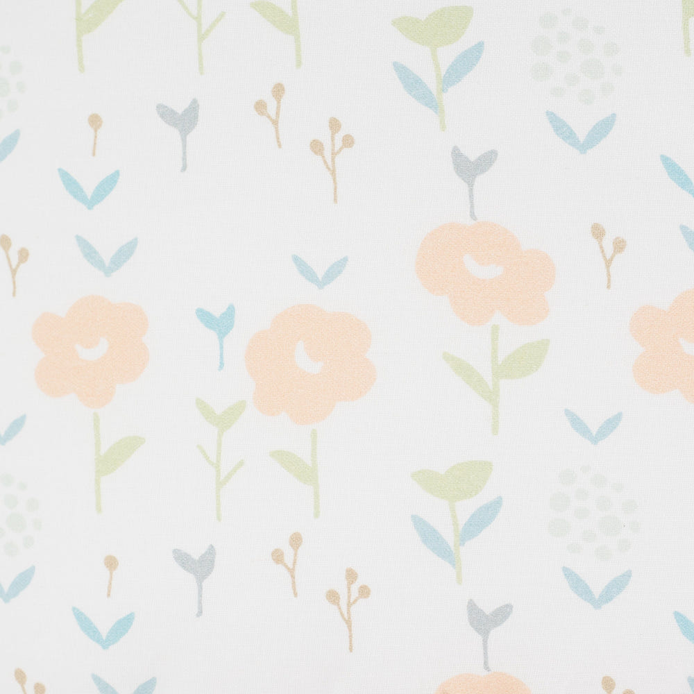 Sealy Pouf in Coral & Blossoms design, perfect for nursery decor and comfortable seating.