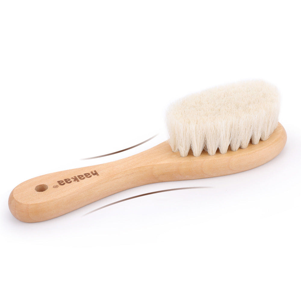 Haakaa Goats Wool Wooden Baby Hairbrush for gentle grooming and oral care, perfect for infants.