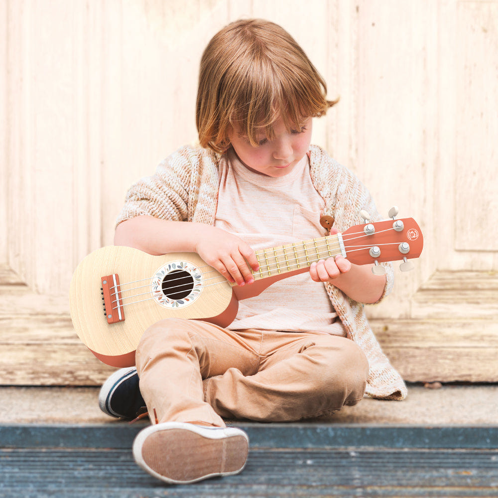 Colorful ukulele for babies, perfect musical toy to inspire creativity and fun in early childhood.