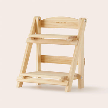 Tiny Land® wooden rack for play kitchen accessories, perfect for storing play food in a child's play area.