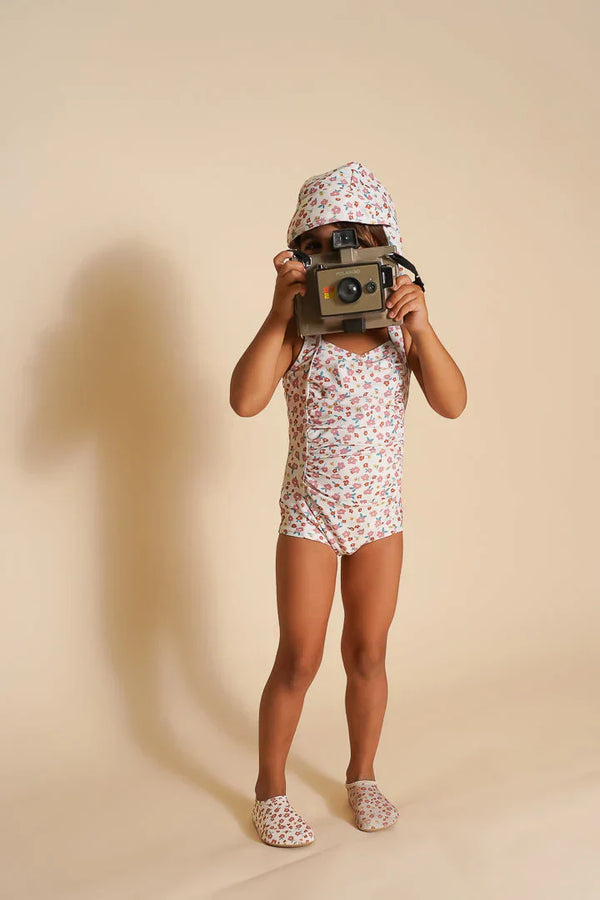 Vintage girls' 1 piece swimsuit in Sunset Meadow, UPF protection, made from recycled materials, angle view 4.