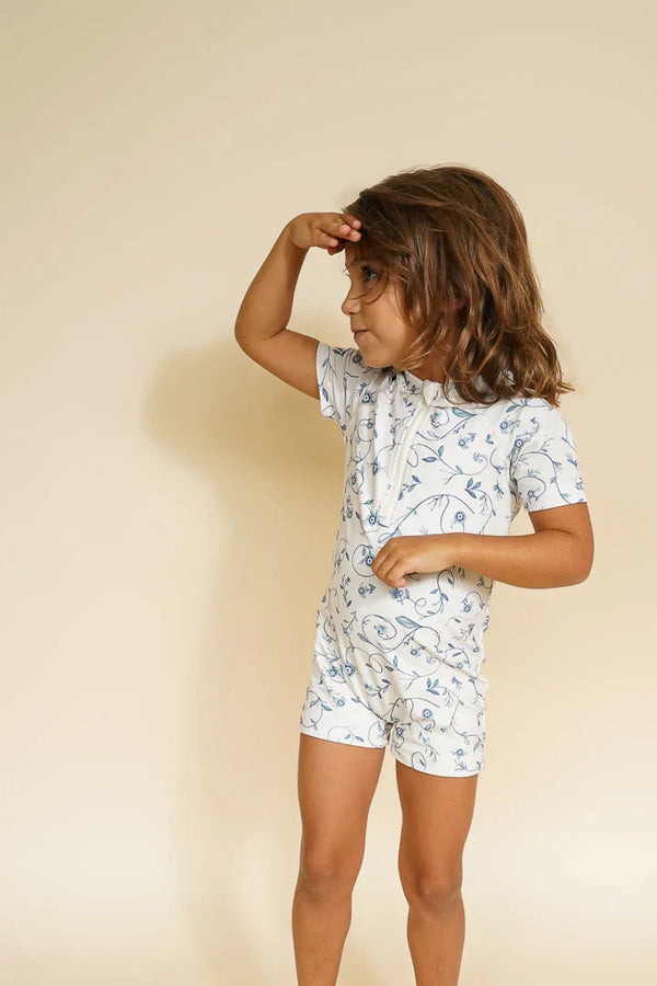 Short Sleeve Rashguard Swimsuit in Scandi Floral, UPF protection, eco-friendly, angle view 4. Perfect for baby beach days.