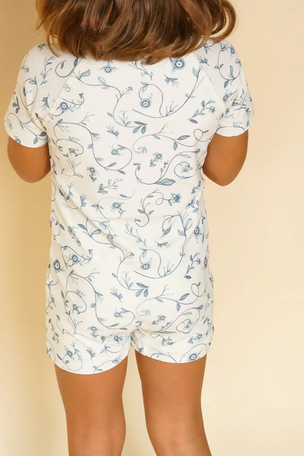 Short sleeve rashguard swimsuit in Scandi floral design, UPF protection, eco-friendly, angle 3 view.