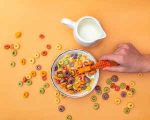 Tractor utensils for babies, perfect for feeding, shown from angle 3 in vibrant colors.