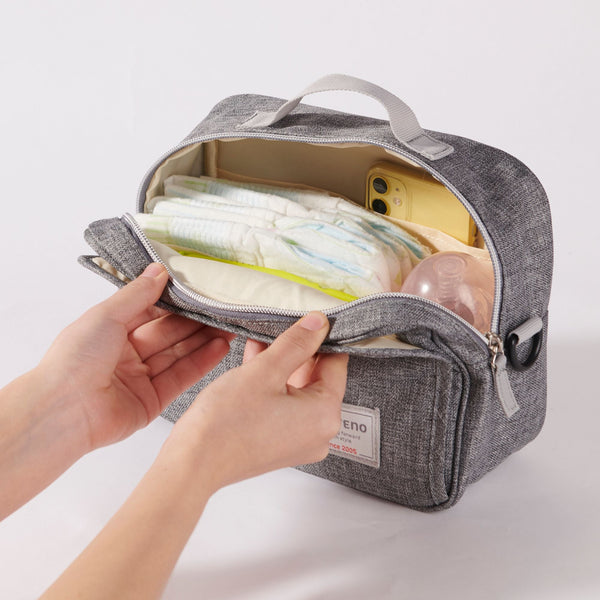 Stylish diaper changing bag at angle 3, perfect for parents on the go.