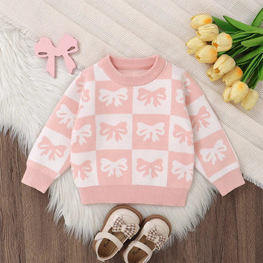 Baby girl sweater with bow print, checkered design, crew neck, long sleeves, perfect for fall outfits.