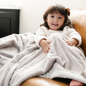 LUSH TODDLER BLANKETS in soft fabric, perfect for cozying up your little one. Angle 2 view showcasing vibrant colors.