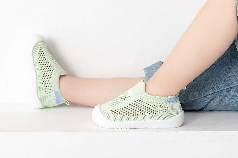 Green baby first walkers, perfect for little feet taking their first steps in style and comfort.