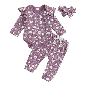 Baby girl floral print romper, long pants, and headband set for spring and fall outfits, angle view.