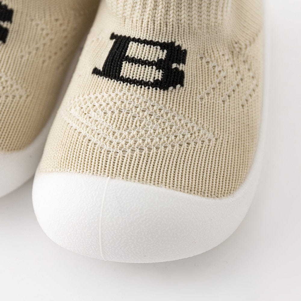 Baby "B" Sock Shoes in Khaki - Soft, stylish footwear for infants, perfect for comfort and support.