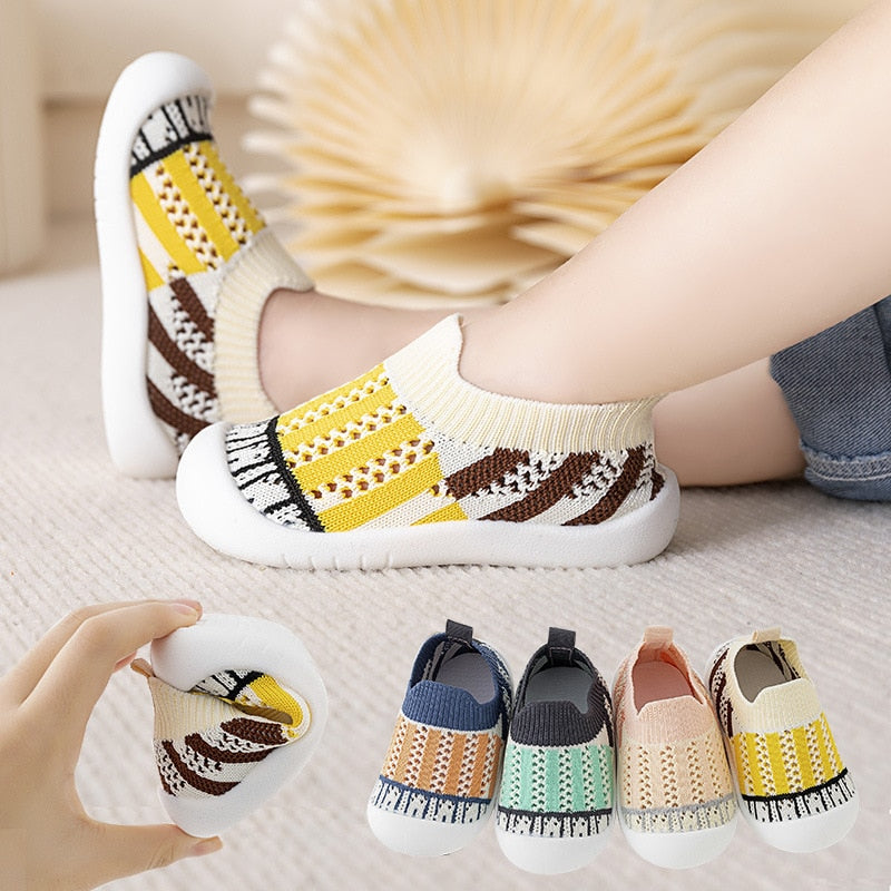 Yellow striped baby first walkers for infants, perfect for early steps and stylish comfort.