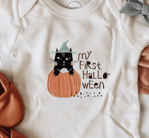 Graphic bodysuit for babies featuring "My First Halloween" cat design, short sleeve, angle view.