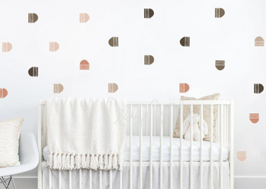 Abstract curved arrows fabric nursery wall art decals for playful and modern baby room decor.