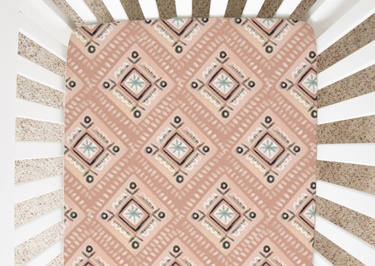 Abstract peach diamond patterned minky and jersey crib sheets for stylish baby nurseries.