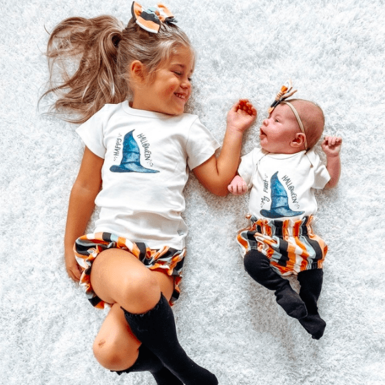 Graphic bodysuit with "My First Halloween" hat for babies, perfect for festive celebrations.