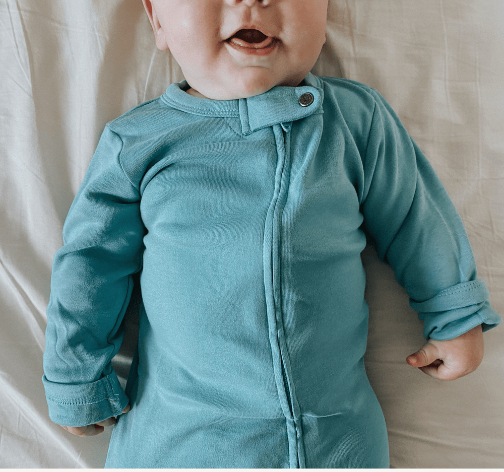 Vintage aqua footie for babies, perfect for cozy comfort in hats, socks, and mittens collection.