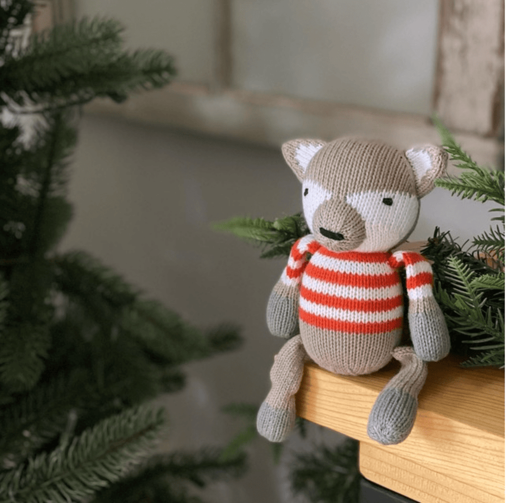 Knit doll rattle buddy Finley the Fox, perfect for baby's playtime and sensory development.