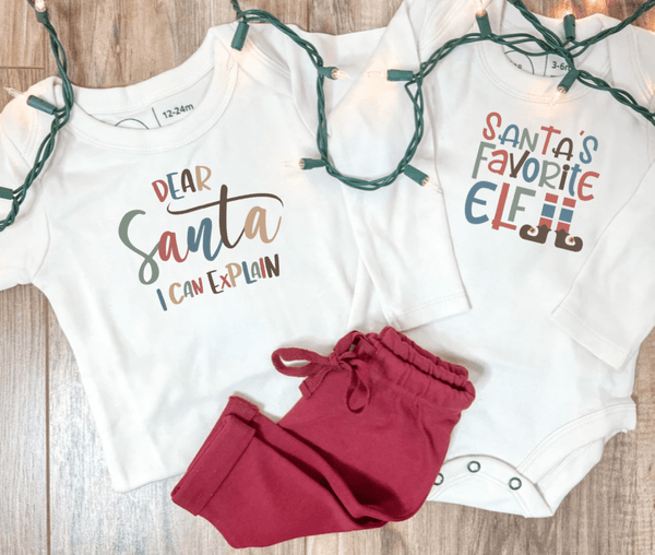Long sleeve graphic bodysuit for babies, "Santa's Favorite Elf," in a playful design, angle view 3.