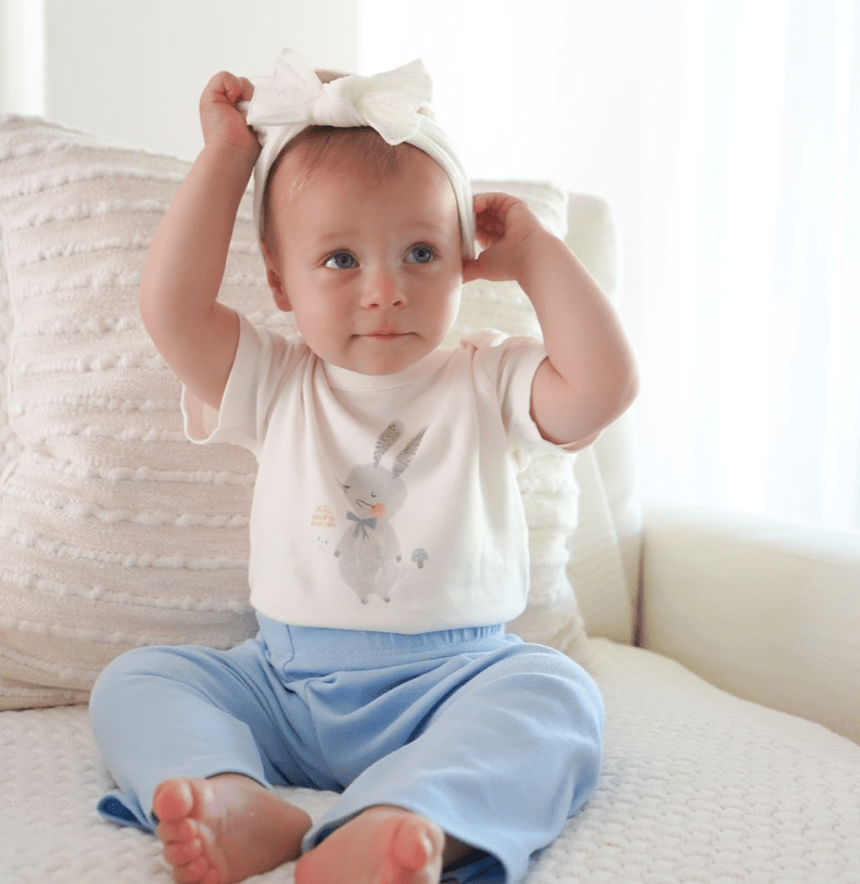 Spring bunny graphic bodysuit for babies, short sleeve design, perfect for playful spring outfits.