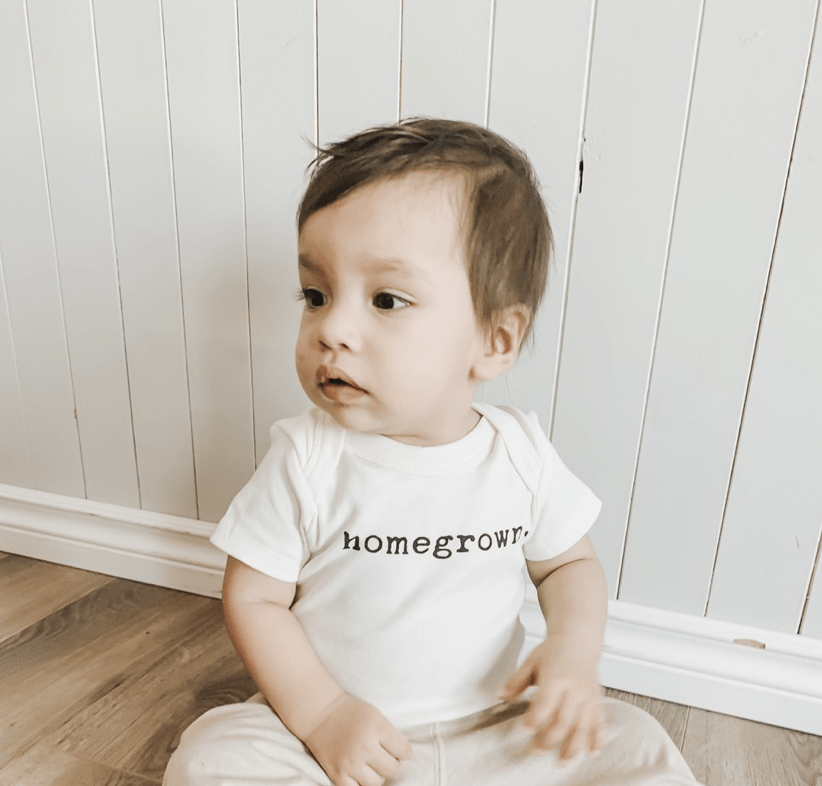 Homegrown graphic bodysuit for babies, short sleeve design, perfect for comfort and style.