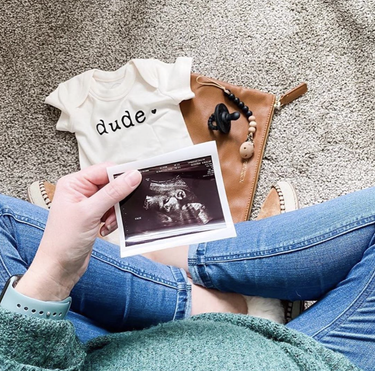 Graphic bodysuit for babies with "Dude" print, perfect for stylish short sleeve outfits.