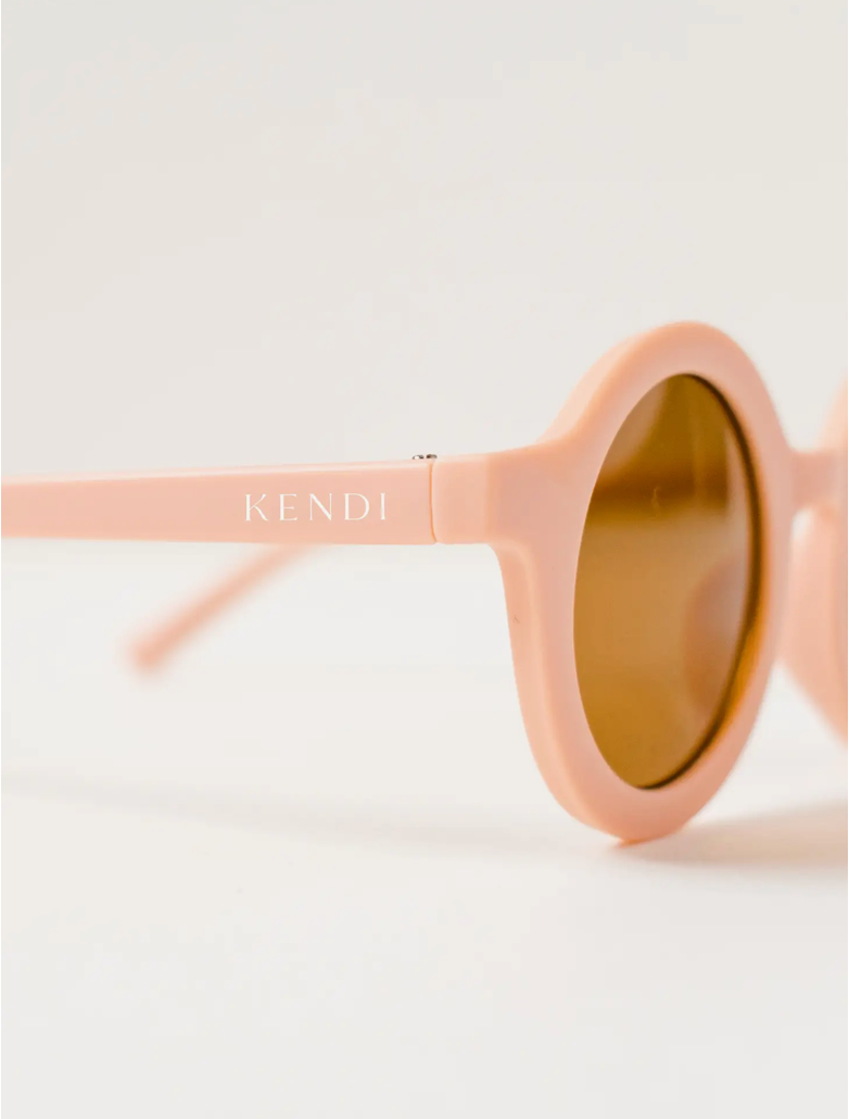 Blush round sunglasses for babies and toddlers, perfect for sunny days.