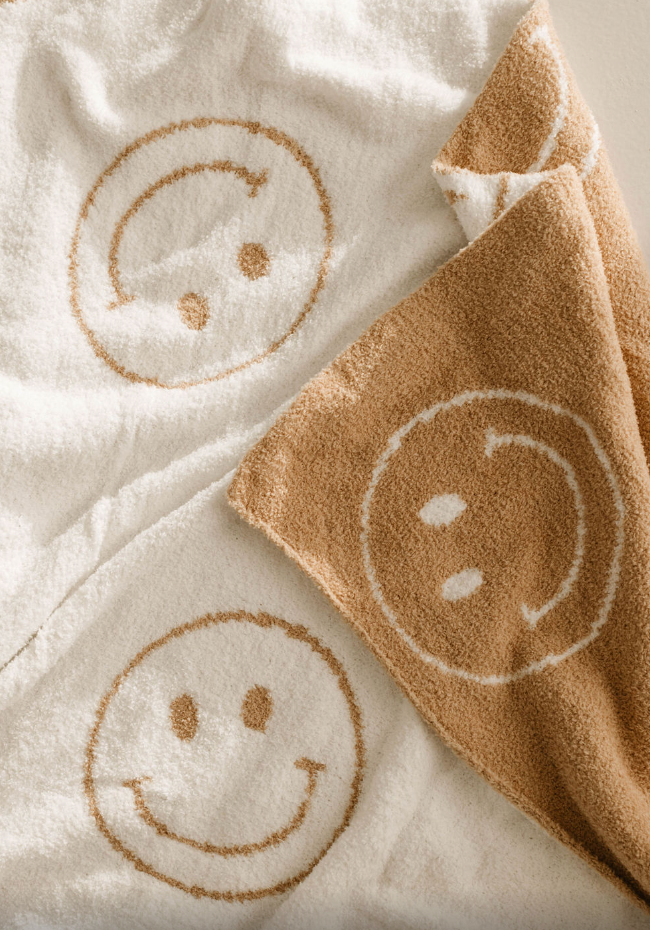Soft plush blanket for babies by Just Smile, perfect for swaddling and keeping little ones cozy and warm.