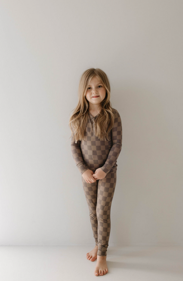 Bamboo two-piece pajama set in faded brown checkerboard for babies. Soft, stylish, and comfortable sleepwear.