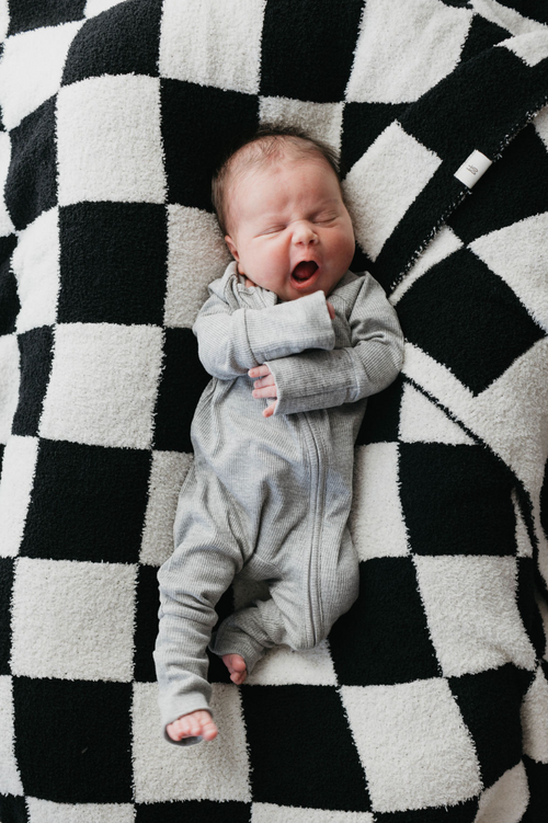 Bamboo zip pajamas in ribbed grey for babies, showcasing angle 4 view. Soft, breathable, and stylish sleepwear.