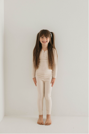 Bamboo two-piece ribbed cream pajamas for babies, perfect for comfortable sleep.