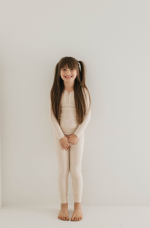 Bamboo ribbed cream two-piece pajamas for babies, perfect for cozy sleepwear.