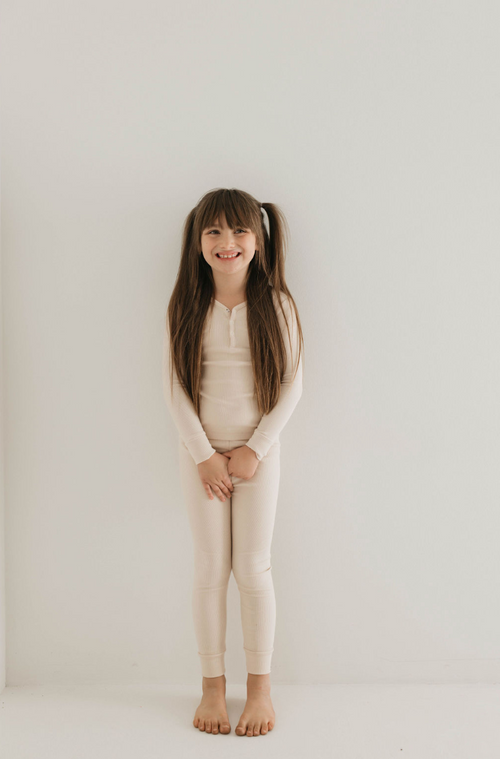 Bamboo ribbed cream two-piece pajamas for babies, perfect for cozy sleepwear.
