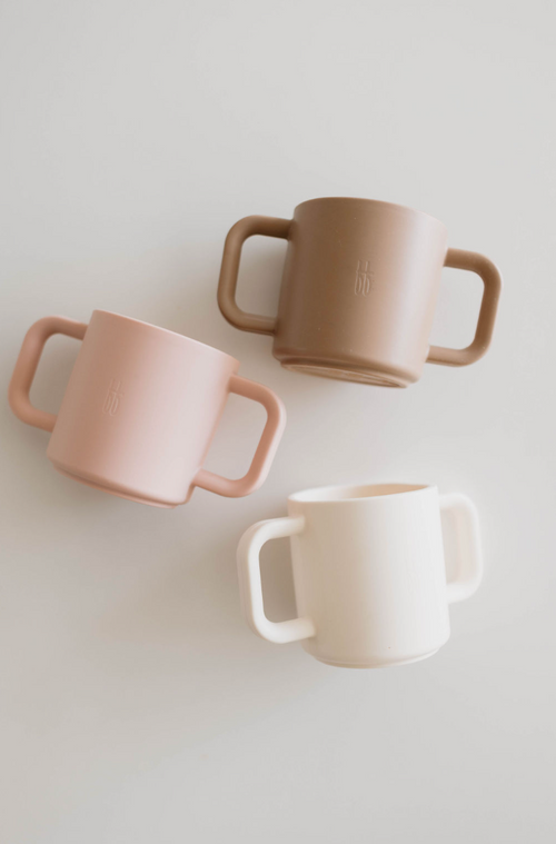 Silicone training cup for babies, perfect for developing independent drinking skills. Safe and easy to grip.
