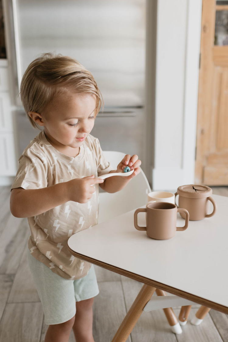 Silicone training cup for babies, perfect for developing independent drinking skills. Safe and easy to grip.