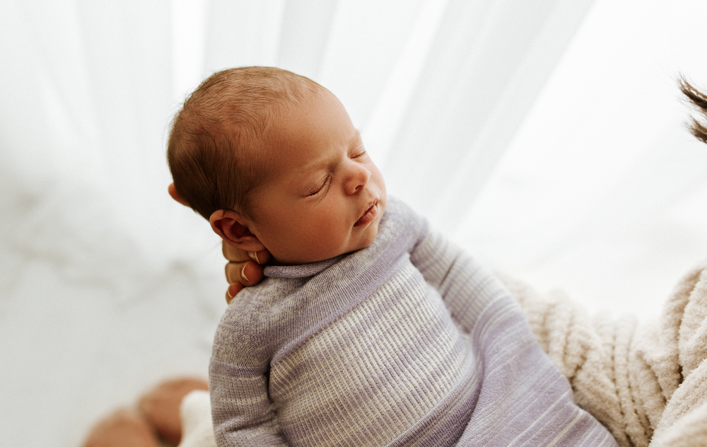 Lavender Swaddle Sleep Sack for babies, soft and cozy, perfect for peaceful sleep and comfort.
