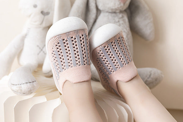 Pink mix baby first walkers, angle view, perfect for little feet taking their first steps.