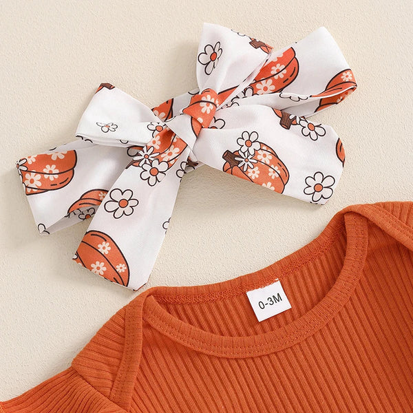 Baby girls' Halloween outfit set with ribbed romper, pumpkin print pants, and headband, angle view 4.