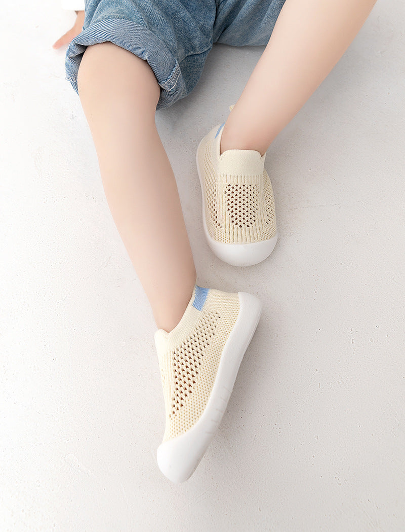 Yellow baby first walkers, perfect for tiny feet taking their first steps. Stylish and comfortable shoes for infants.