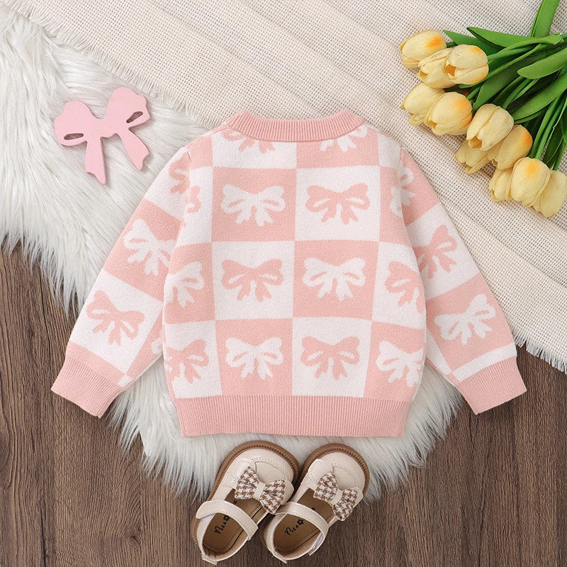 Baby girl sweater with bow print, checkered design, crew neck, long sleeves, perfect for fall outfits.
