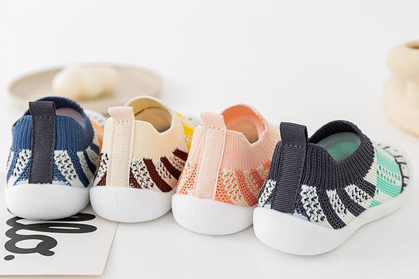 Pink striped baby first walkers, perfect for tiny feet taking their first steps.