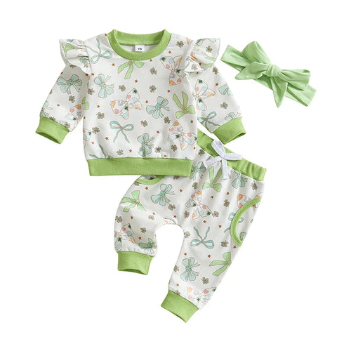 Baby girls' 3-piece St. Patrick's Day outfit with shamrock print top, jogger pants, and headband, angle view.