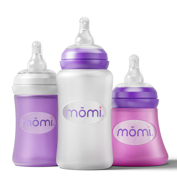 Mōmi silicone 4 oz glass bottle sleeves in various colors, showcasing angle 3 design for baby bottle accessories.