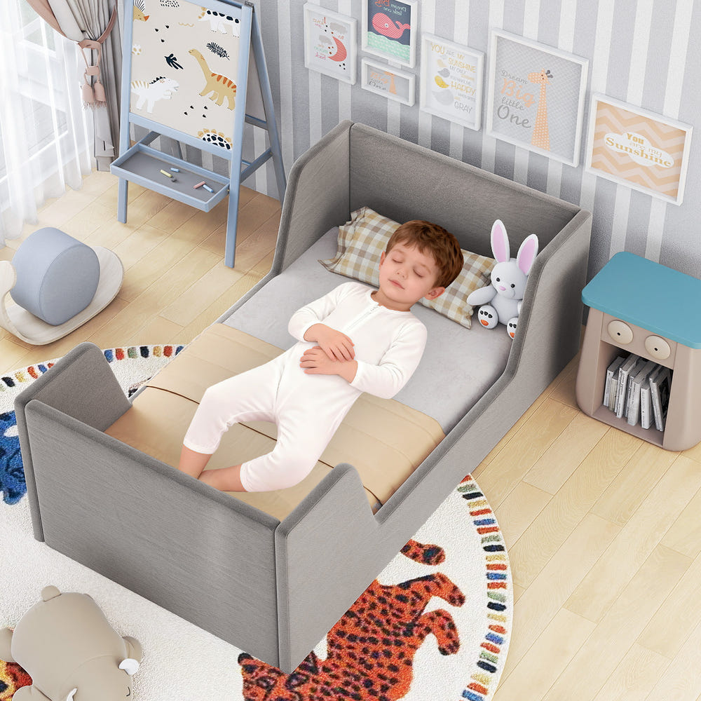 Soft velvet toddler bed frame with safety rails, perfect for a cozy and secure sleep environment.