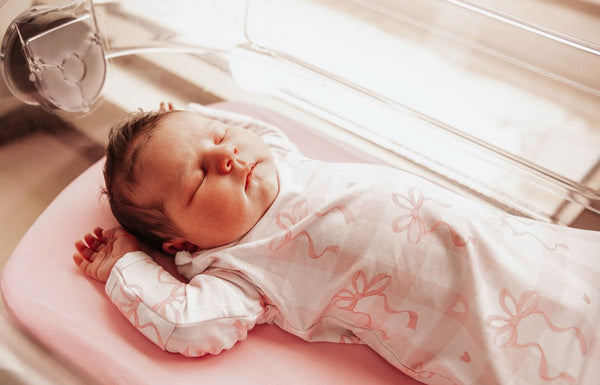 Sophie Knotted Gown Set in soft fabric, angle view showcasing design and comfort for newborns.