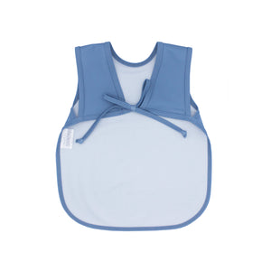 Solid dusty blue minimalist bapron for babies, angled view showcasing its stylish and functional design.