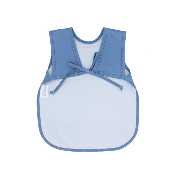 Solid dusty blue minimalist bapron for babies, angled view showcasing its stylish and functional design.
