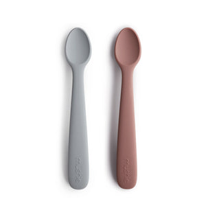 Silicone feeding spoons for babies in vibrant colors, angled view showcasing their soft, safe design for mealtime.