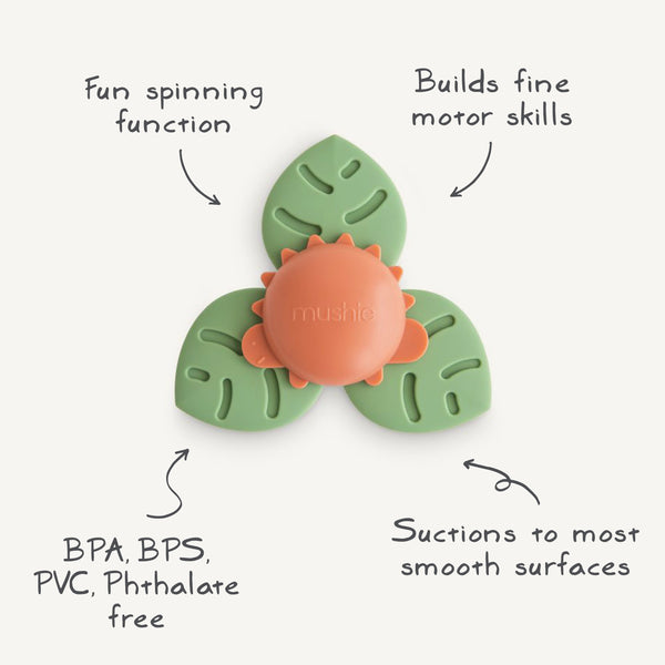 Dino Suction Spinner Toy for babies, colorful bath toy with suction base, engaging playtime at angle 2.