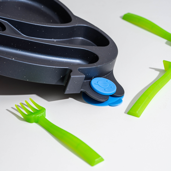 UFO Training Plate and Utensils for babies, featuring a colorful design and ergonomic shapes for easy feeding.