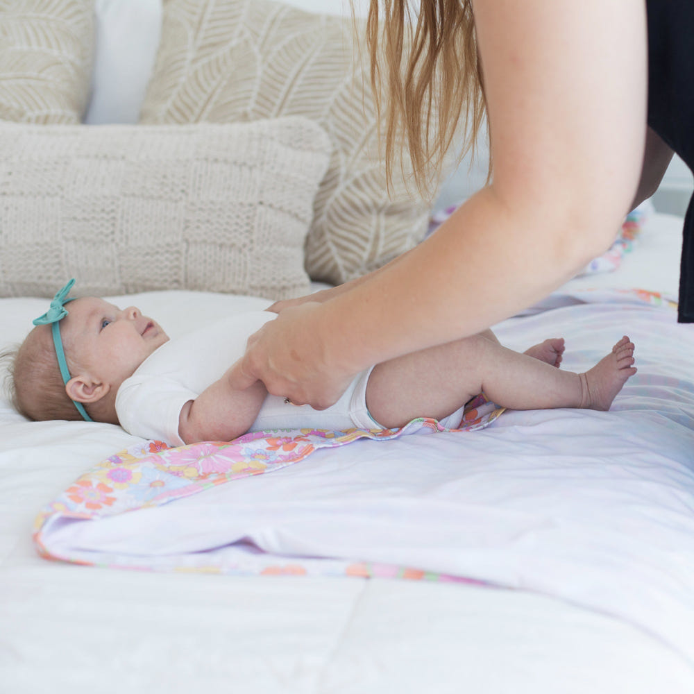 Retro floral baby swaddle blanket, perfect for cozying up your little one in style.